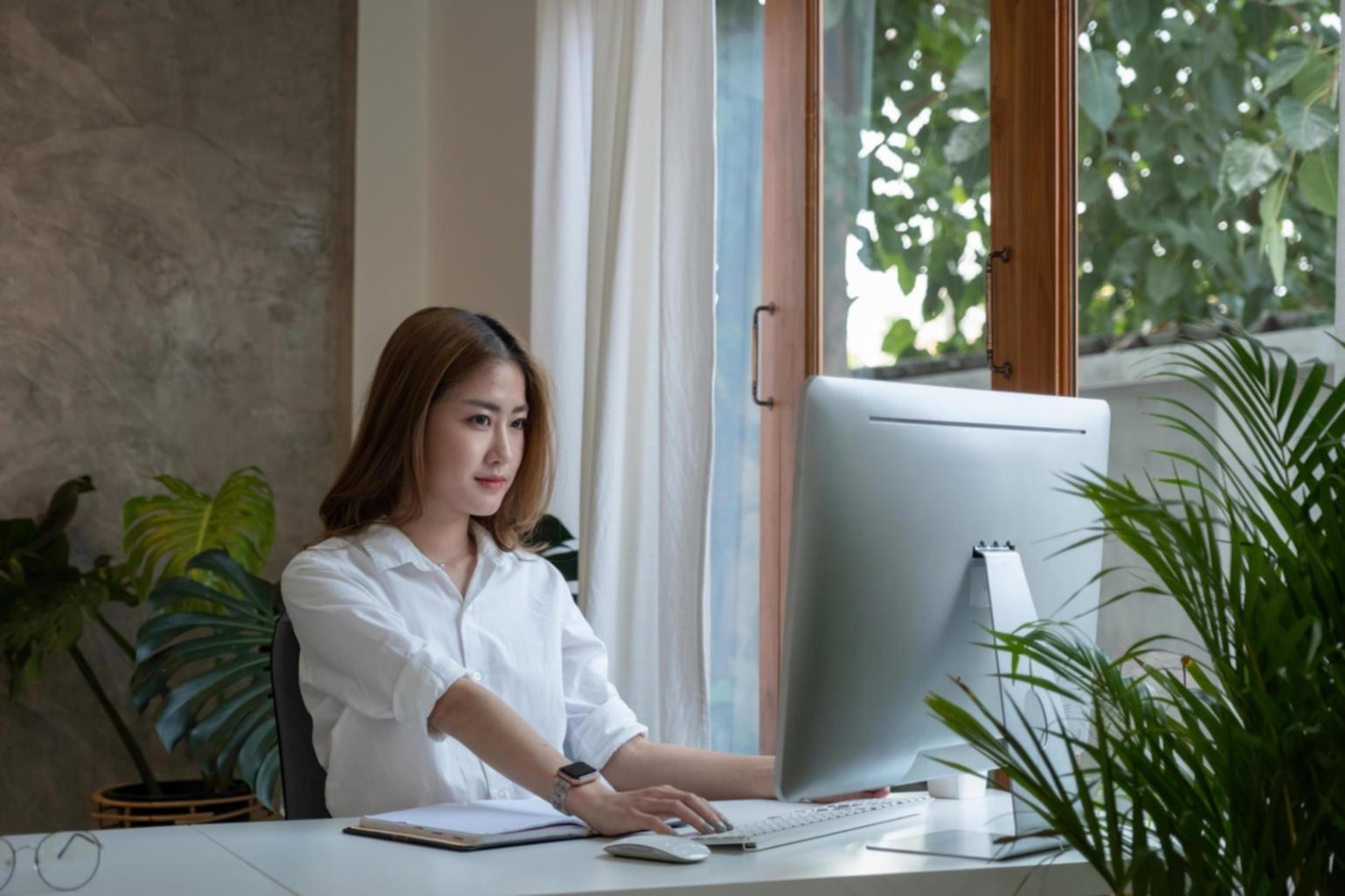 Business owner reviewing financial reports with detailed charts